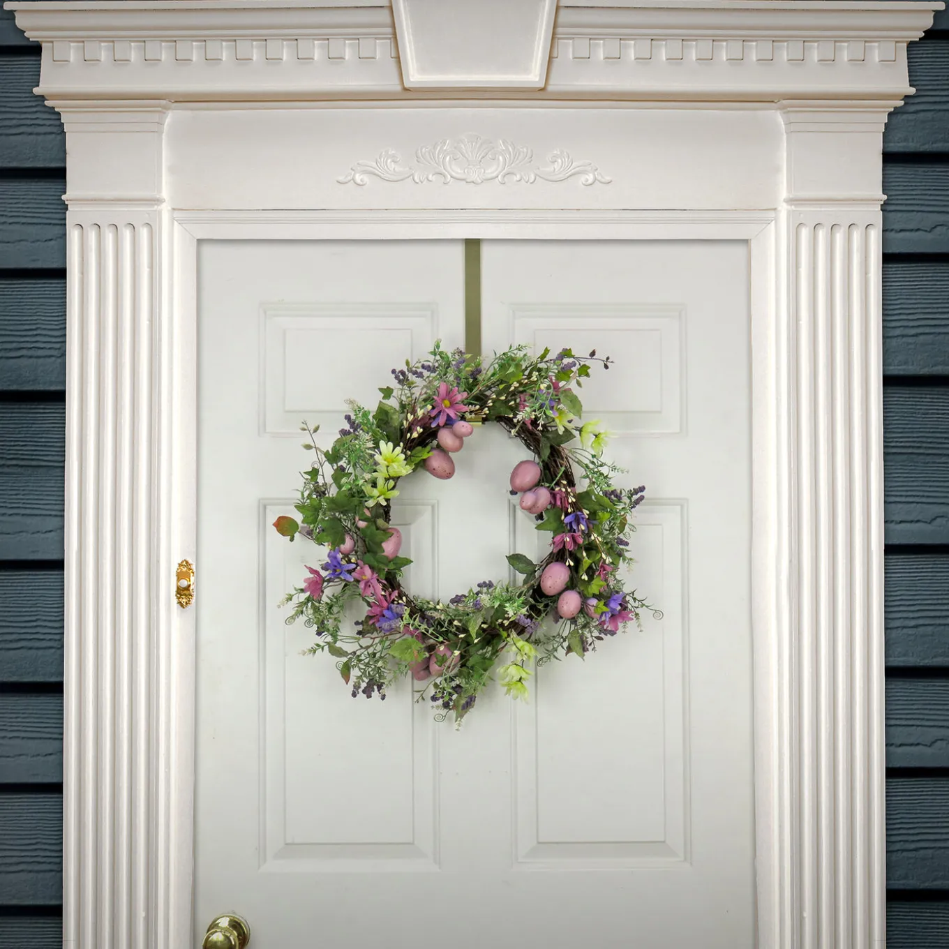 22 in. Easter Wreath Decorated with Purple Pastel Eggs, Pink Flowers, Leafy Greens