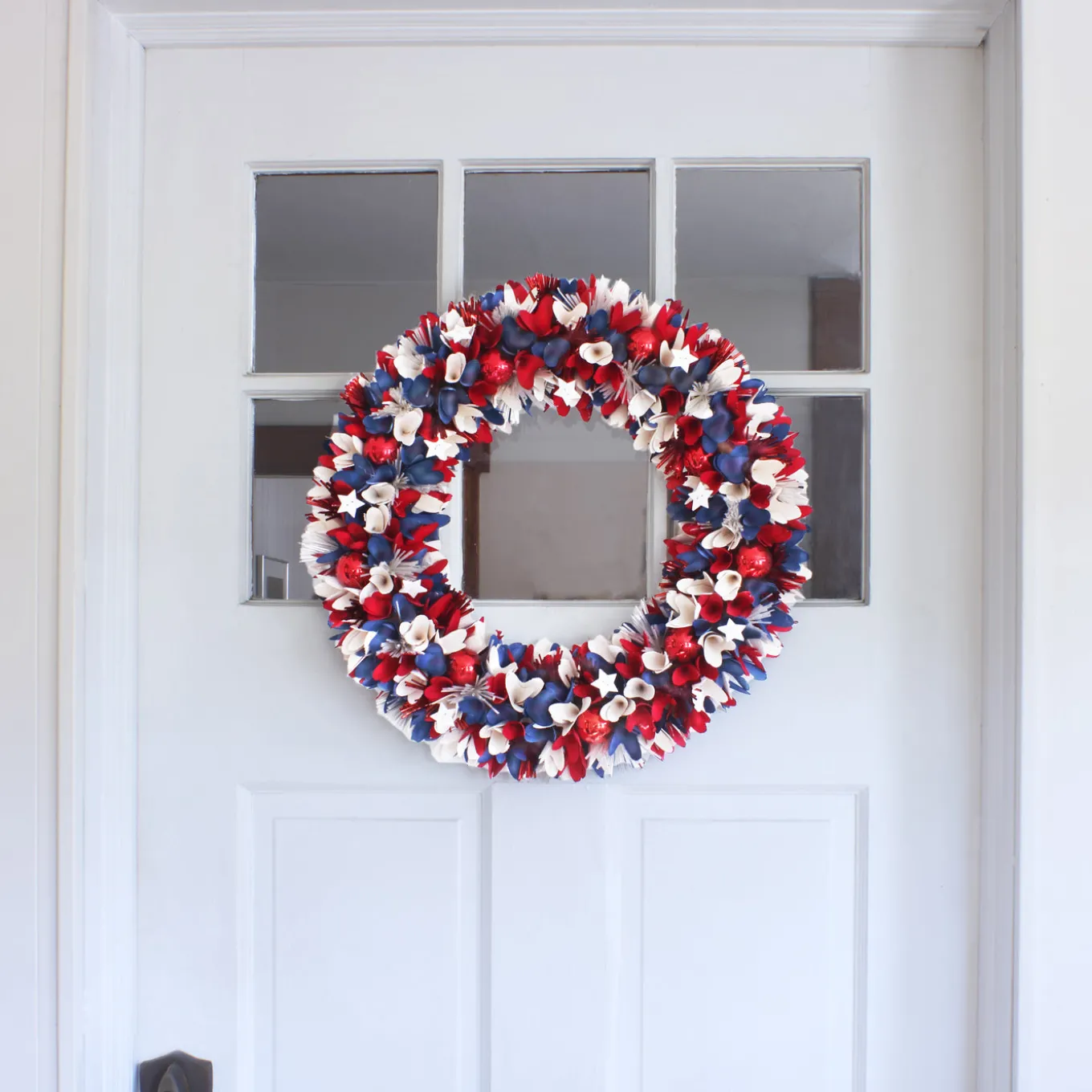 21 in. Patriotic Wreath with Red White and Blue Flowers Petals Tinsel